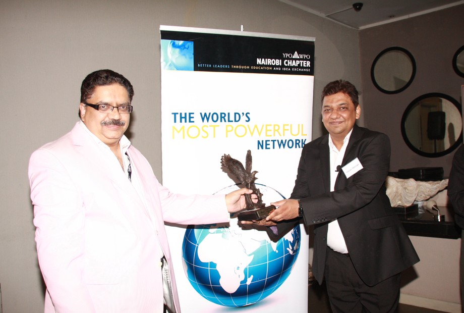 Vijay Mistri receiving award from YPO WPO Nairobi Chapter